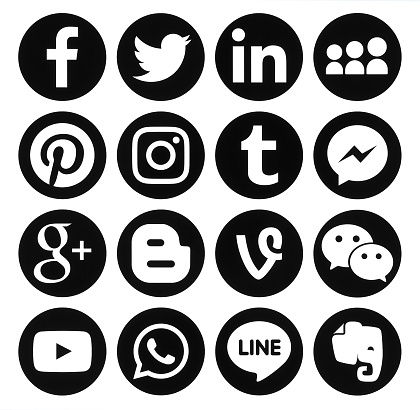 Kiev, Ukraine - October 25, 2016: Collection of popular black round social media icons printed on paper: Facebook, Twitter, Google Plus, Instagram, Pinterest, LinkedIn, Blogger, Tumblr and others