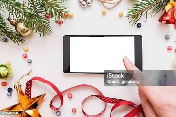 Woman Using Smartphone Christmas Discounts Stock Photo - Download Image Now - Christmas, Technology, Mobile Phone