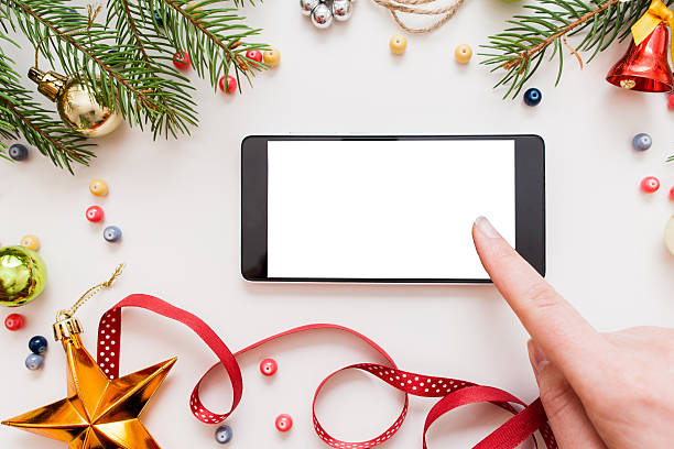 woman using smartphone, christmas discounts - ipad shopping gift retail imagens e fotografias de stock