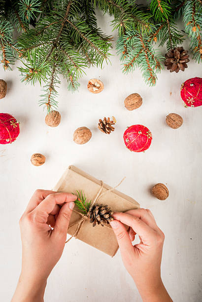 istock Girl decorates the gift in the Rustic style 619510526