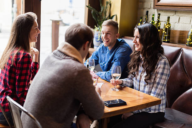 istock Friends socializing over wine 619512224