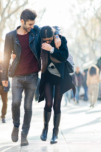istock Young couple in love walking in Barcelona's Ramblas. 619512362