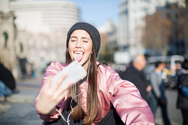istock Young woman with smart phone in Barcelona, technology. 619512930