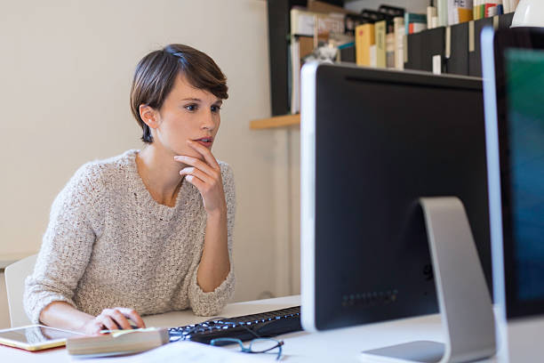 istock Business woman working in small  office, Barcelona. 619513092