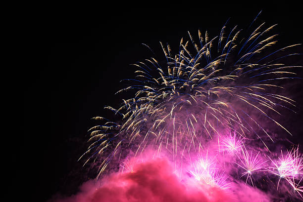 istock Fireworks light up the sky wit smoke. Colorful. 619514502