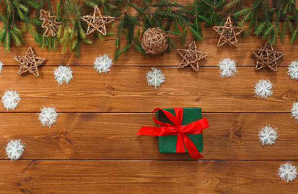 istock Christmas decoration, gift box and garland frame background 619517224