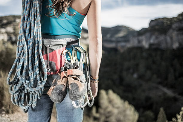 Female rock climber with equipment