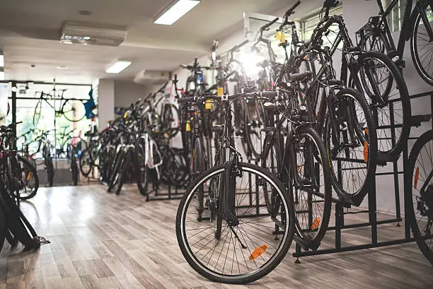 Bicycles arranged inside the bicycle store.