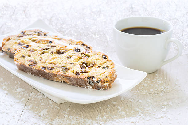 istock Fresh Christmas Stollen on a white plate with Coffee 619520238