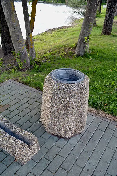 dust bin on resort lake coast and bicycle holder