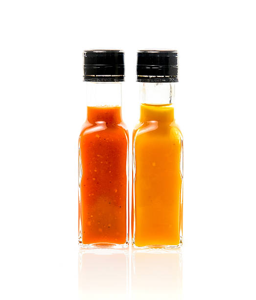 istock Different color home made hot sauce in glass bottles 619523670