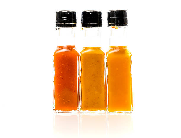 istock Different color home made hot sauce in glass bottles 619523694