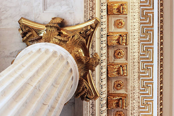 istock Fluted baroque column with gilded Corinthian capital supporting fretwork ceiling 619524400