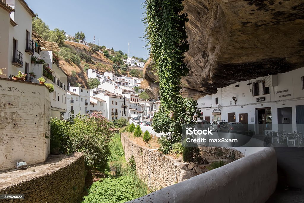 Setenil de las Bodegas, Cadiz, Spain. Setenil de las Bodegas, Cadiz, Spain. Street with dwellings built into rock overhangs above Rio Trejo. Setenil Stock Photo