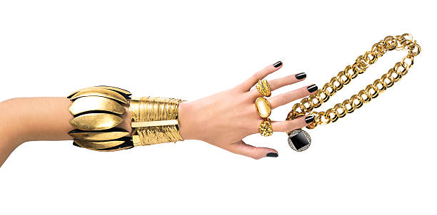 Gold jewelry with hand isolated on white background( with clipping path)