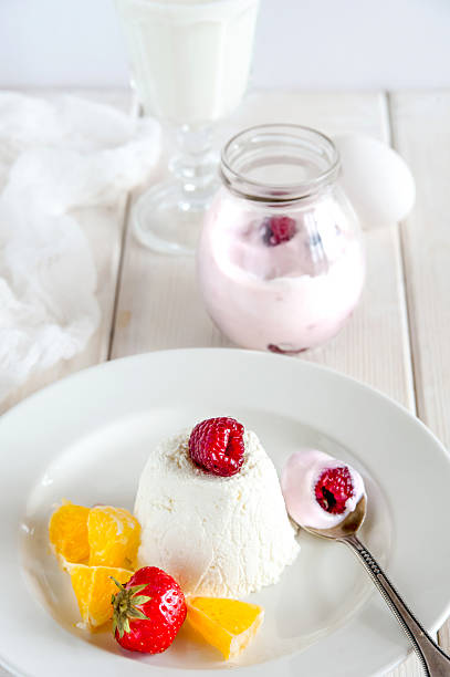 istock Ice cream with berries in white plate 619527110