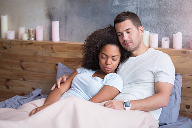 istock Delighted couple having a nap together 619528816