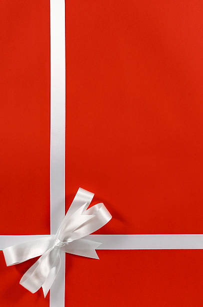 istock Christmas border red background gift bow ribbon vertical 619529922