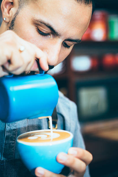 Barista making fresh coffee latte