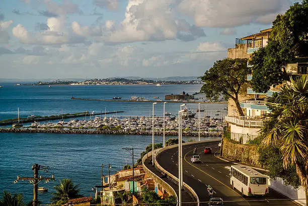 View of the Lower City with the boat marina and the road winding along the cost of the Bay of All Saints, Salvador, Bahia, Brazil