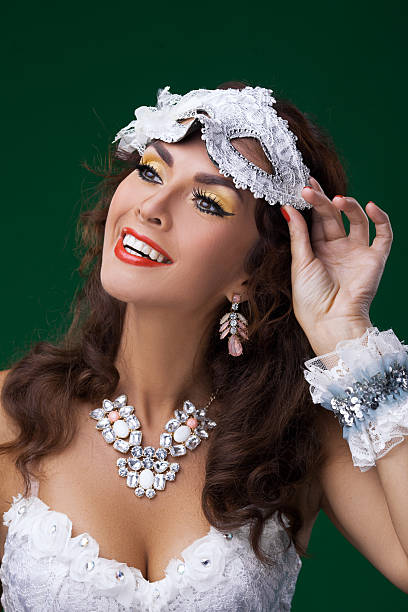 istock Cute woman in masquerade mask 619534192
