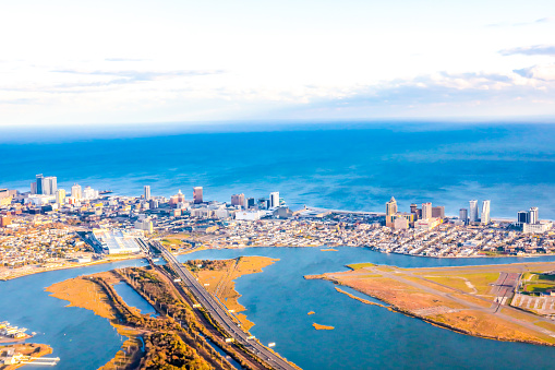 ++3 logo rule++ Aerial view of Atlantic City taken from an airplane. It is a beautiful sunny day with high clouds. The shot taken with a Canon 5D Mark iV shows bright blue Atlantic ocean and bay.