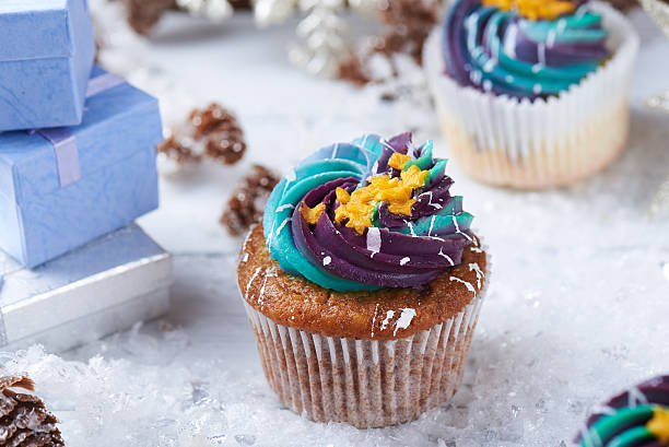 istock Wintery cupcakes on a snow background 619534812