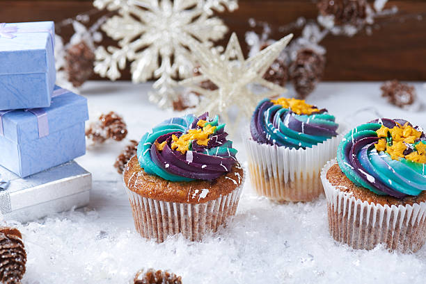 istock Wintery cupcakes on a snow background 619534884