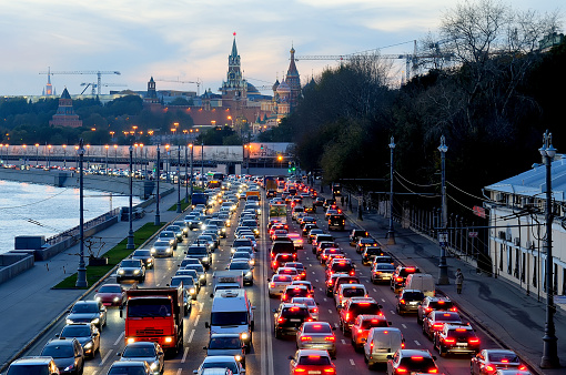 Moscow, Russia - October 16, 2015: Evening traffic jam on one of the embankment of the Moskva River near the Kremlin