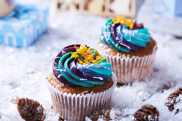 istock Wintery cupcakes on a snow background 619535350