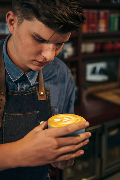 istock Coffeemaker with cup of latte 619535484