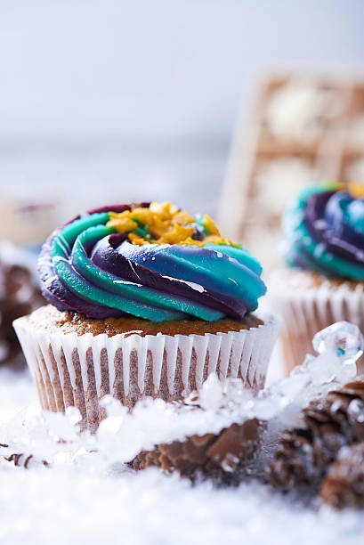 istock Wintery cupcakes on a snow background 619535542
