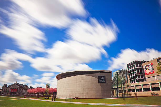 Amsterdam, Netherlands - May 3, 2016:  Long exposure Van Gogh museum, people are unrecognizable. Image of people in the beautiful garden near the Van Gogh Museum in Amsterdam during the spring, Amsterdam, Netherlands