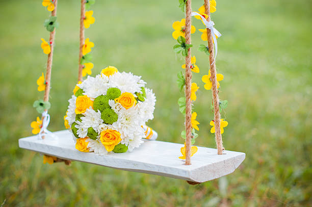 istock Bright bride's wedding bouquet on a swing 619537970