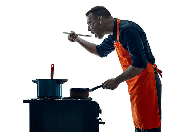 istock man cooking chef silhouette isolated 619539474