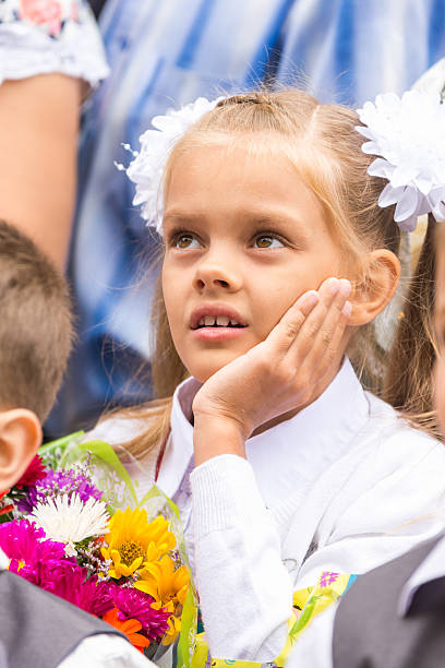 istock First grader on line of first of September thinking 619540296