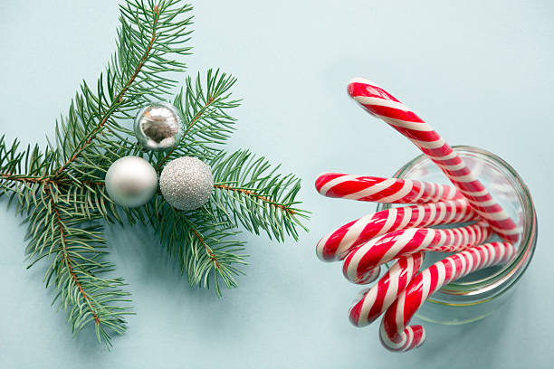 istock Christmas decoration with candy canes with spruce. Above. 619544586