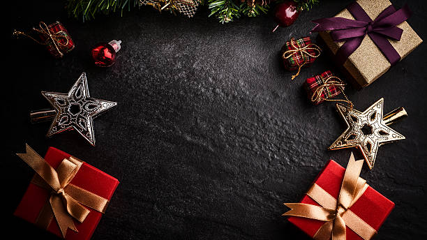 istock Christmas tree with decoration on dark stone background 619544944
