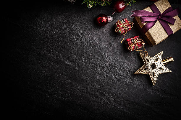 istock Christmas tree with decoration on dark stone background 619545048