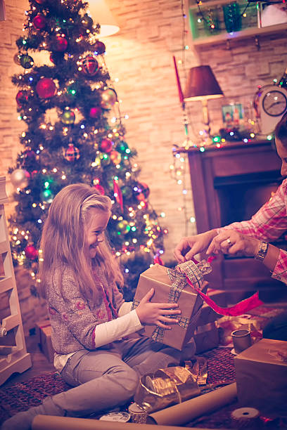 istock Wrapping and Decorating Christmas Presents 619630510