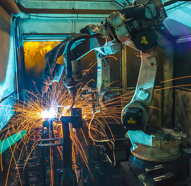 istock welding robot in Industrial automotive 619634748