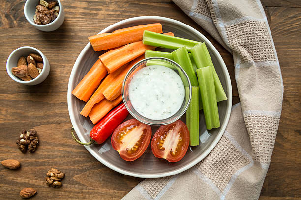 istock Vegetarian healthy snacks, vegetable snack: carrots, celery, tom 619635396