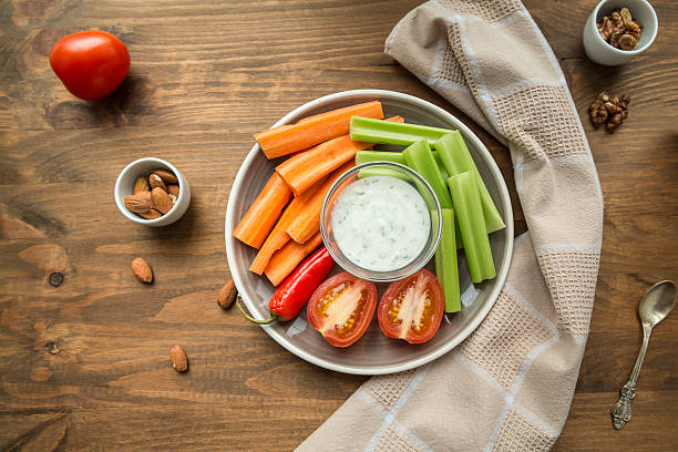 istock Vegetarian healthy snacks, vegetable snack: carrots, celery, tom 619635578