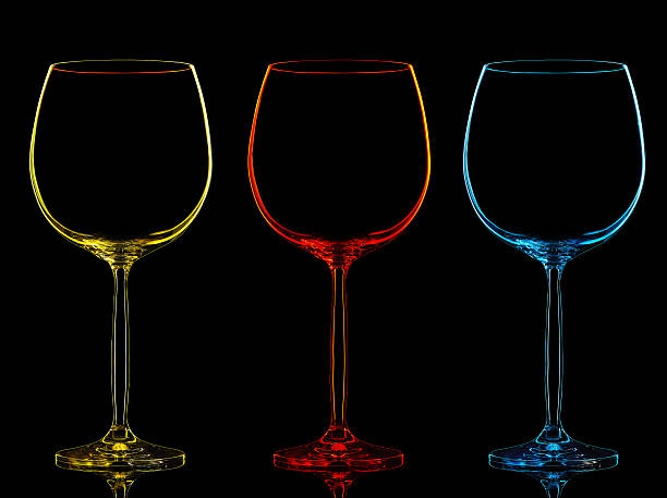 Silhouette of color wine glass on black
