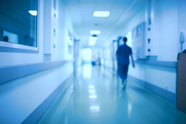hospital corridor and doctor as a blurred defocused background - átrio imagens e fotografias de stock