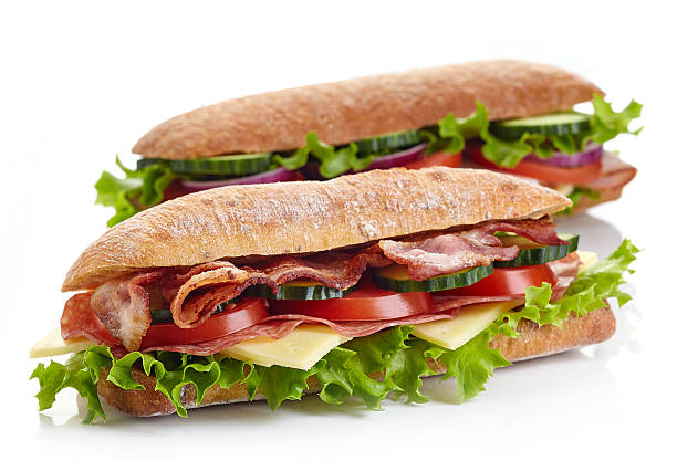 два свежих подводных сэндвича - sandwich delicatessen bacon lettuce and tomato mayonnaise стоковые фото и изображения