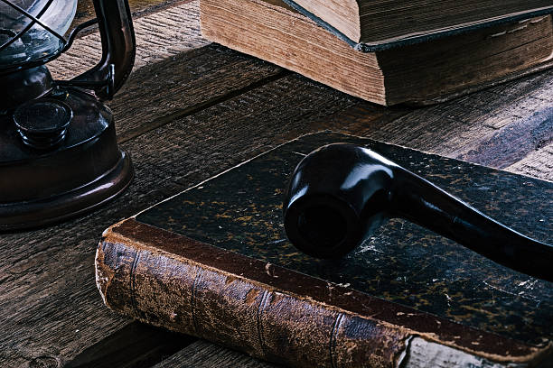 istock Still-life with books and pipe 619641276