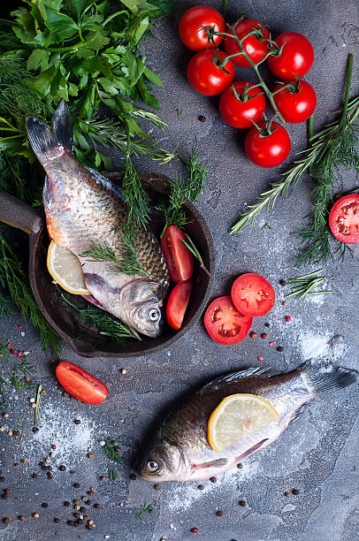 istock Delicious fresh fish on dark vintage background. 619643304