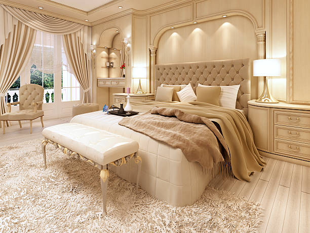 cama de lujo en un gran dormitorio neoclásico con nicho decorativo - neo classical fotografías e imágenes de stock