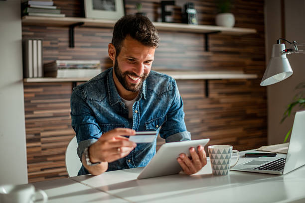 istock Checking his credit card balance 619645214